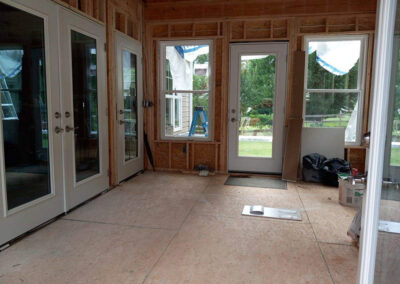 tile and trim samples on the floor of the sunroom project in progress