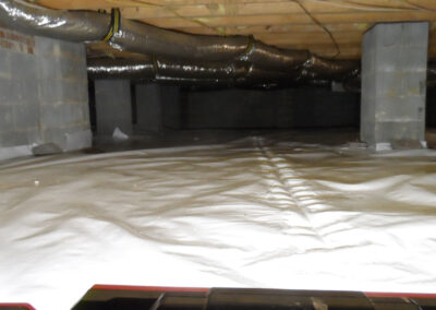 Crawl space repair with new poly coating to repel moisture