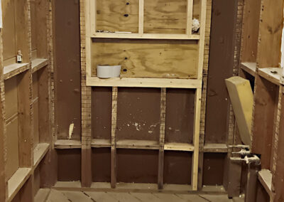 exposed studs mark the beginnings of a custom ceramic shower stall