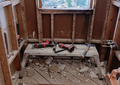 window cutout of wall in preparation for natural light in a bathroom renovation