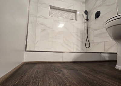 new luxury vinyl plank floor in a bathroom remodel