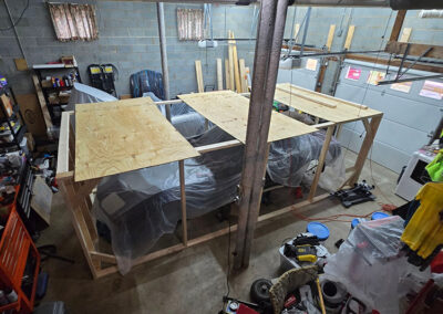 protective crate built to protect a race car from falling construction debris
